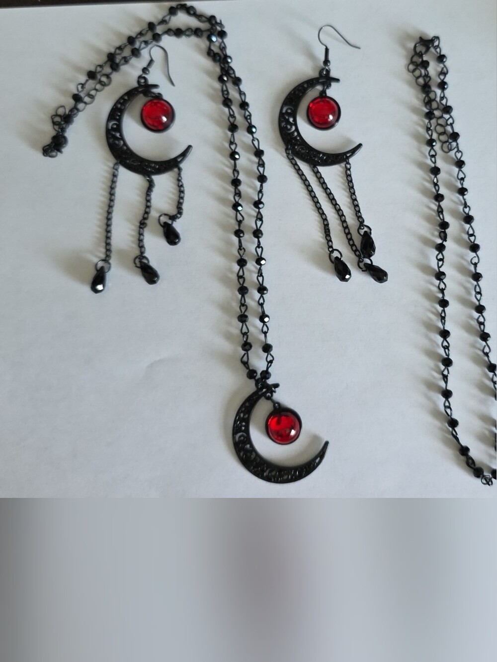 Black Crescent Moon Necklace and Earring Set with Red Gemstone